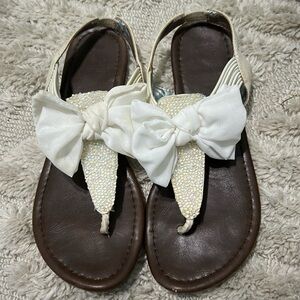 Material Girl white flat bow sandals